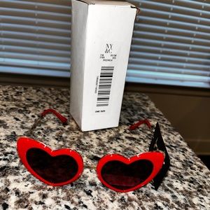 Red heart shaped sunglasses. One size fits most.